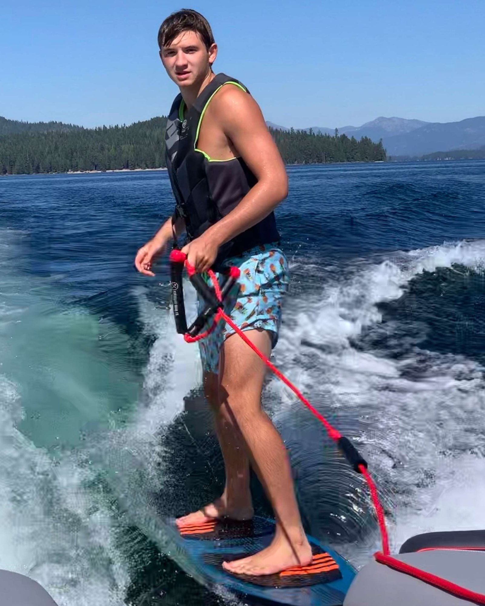 PHOTO: Ethan Chapin surfs on Priest Lake in northern Idaho in this family photo from July 2022. 